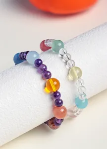 Detail view of multi-gemstone bracelets with amethyst, quartz and aquamarine beads