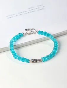 Close-up of blue amazonite beaded bracelet with engraved S925 silver fish charm