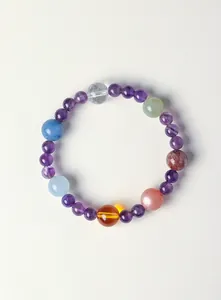 Macro view of a colorful natural amethyst bracelet with mixed crystal gemstones