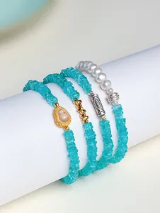 Detailed close-up of natural Amazonite bracelets with freshwater pearls and gourd charm