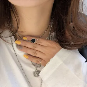 Vintage Halskette aus 925 Sterling Silber mit schwarzem Stein und Engelsanhänger