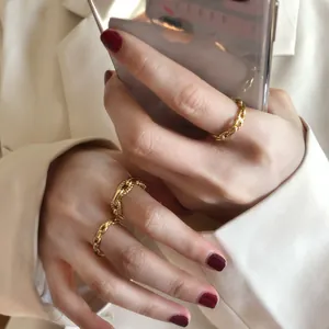 Detailed macro view of S925 sterling silver chain ring with elegant gold plating