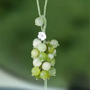 Elegant green jade grape pendant for car or bag charm with white flower accent