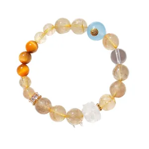 Élégant bracelet en quartz rutilé doré avec breloque lotus en cristal blanc pur