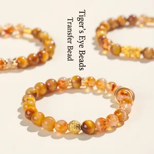 Natural tiger eye and yellow crystal beaded bracelet with gold fortune bead detail