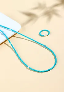 Detailed view of handmade natural turquoise and aquamarine beaded jewelry set for women