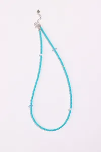 Detailed view of natural turquoise and aquamarine beaded necklace with silver clasp