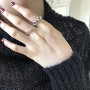 Detailed shot of a S925 sterling silver chain ring with pig nose link design