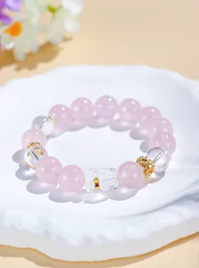 Elegant rose quartz and clear crystal beaded bracelet with a cute bear charm detail