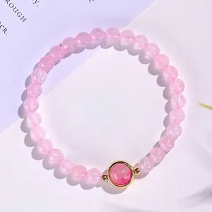 Natuurlijke roze kristallen kralenarmband voor dames met gouden bedel