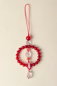 Detailed view of handmade crystal car hanging ornament with red beads and fox charm