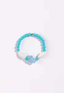 Detailed view of a natural turquoise and aquamarine beaded bracelet with shell accents.
