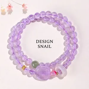 Bracelet double rang en améthyste naturelle avec breloques en agate blanche et jade.
