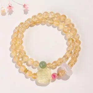 Bracelet élégant en cristal jaune naturel avec jade vert sculpté et accents de tourmaline