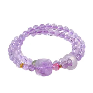 Bracelet à perles d'améthyste à double rang avec breloque Zhajilamu et bague en agate blanche.