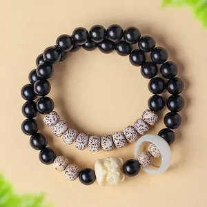 Natuurlijk sandelhout armband met Bodhi-zaden en een handgesneden leeuwenhanger voor dagelijks.