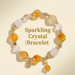 Elegant natural citrine and rutilated quartz crystal bracelet with golden charms for women