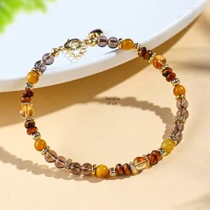 Natürliches Tigerauge- und Kristallperlenarmband mit Goldakzenten