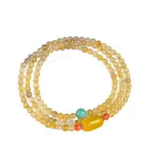 Pulsera multicapa de cuarzo rutilado dorado con detalle de ágata amarilla