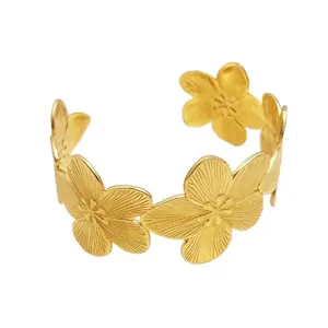 Elegante bracciale rigido largo a fiori dorati con design aperto e regolabile Oro