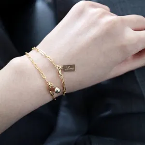 Minimalist 14K gold filled chain bracelet featuring LOVE tag and small ball charm