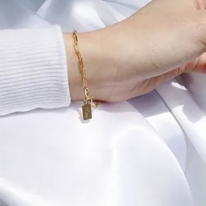 Minimalist 14K gold filled paperclip chain bracelet with engraved Love charm tag