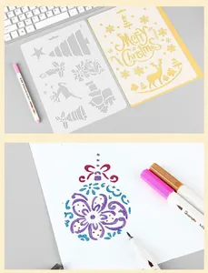 Detail view of Christmas DIY stencils and metallic pens for creative scrapbooking cards