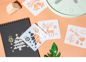 Detail showing Christmas painting stencils with reindeer and tree patterns for DIY art