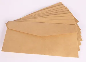 Detailed macro view of stacked vintage No. 5 kraft paper envelopes for wedding invitations