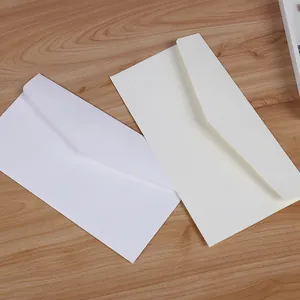 Minimalist Western-style No. 5 blank envelopes in white and cream paper for invitations