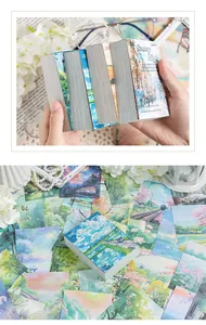 Gros plan de blocs de papier décoratifs sur le thème des paysages pour le scrapbooking