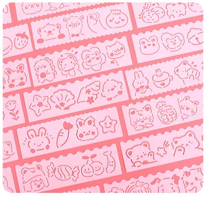 Close-up detail of cute pink cartoon hollow-out drawing stencils for DIY scrapbooking projects