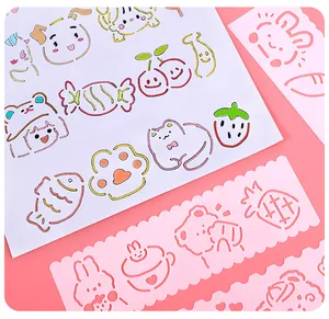 Close-up view of cute cartoon hollowed-out drawing stencils for DIY handbooks and kids art.