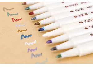 Detailed close-up of STA metallic paint markers showing colorful tips and ink strokes on paper