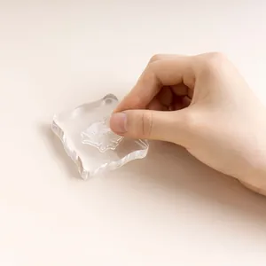 Clear acrylic stamp block for DIY journaling and crafts featuring ergonomic wavy edges