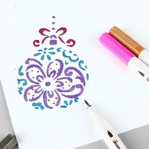 Colorful dual tip marker pens drawing creative Christmas patterns for DIY journals