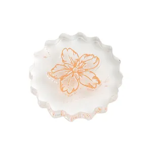Minimalist clear acrylic stamp handle with scalloped edges and orange flower design