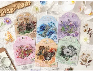 Detailed flat lay of vintage floral PET sticker packs for journaling