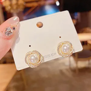 Eleganti orecchini a perno in stile francese con perla, spirale oro e argento S925