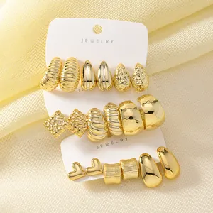 Macro view of the 3-piece gold fashion earring set featuring C-shape and twist textures.