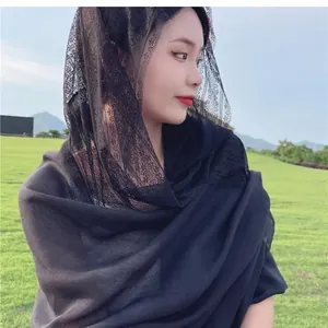 Detailed view of an elegant black lace spliced cotton linen shawl scarf worn as a veil