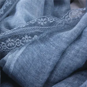 Soft greyish-blue linen cotton scarf featuring a delicate floral lace trim for women