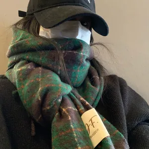 Premium retro green plaid cashmere-like winter scarf shown on a model for a cozy look