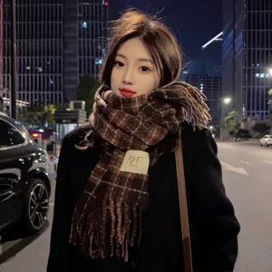 Warm winter brown retro plaid fringe scarf for women styled on a model at night