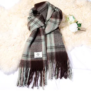 Cozy plaid mohair-style winter scarf in brown and mint green with fringe details