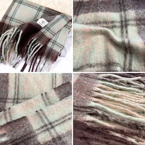 Sage green and brown plaid mohair-style thick winter scarf with long fringed edges.