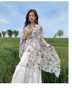 Elegant ethnic ginkgo leaf print shawl with traditional frog buttons for travel and vacation