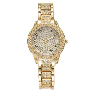 Macro view of luxurious gold-tone women's quartz watch with full rhinestone dial