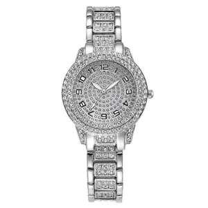 Detailed view of silver-toned women's quartz watch fully covered in sparkly rhinestones