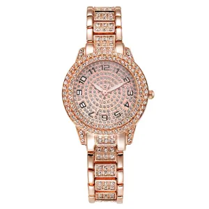 Detailed view of rose gold ladies quartz watch fully encrusted with rhinestones.